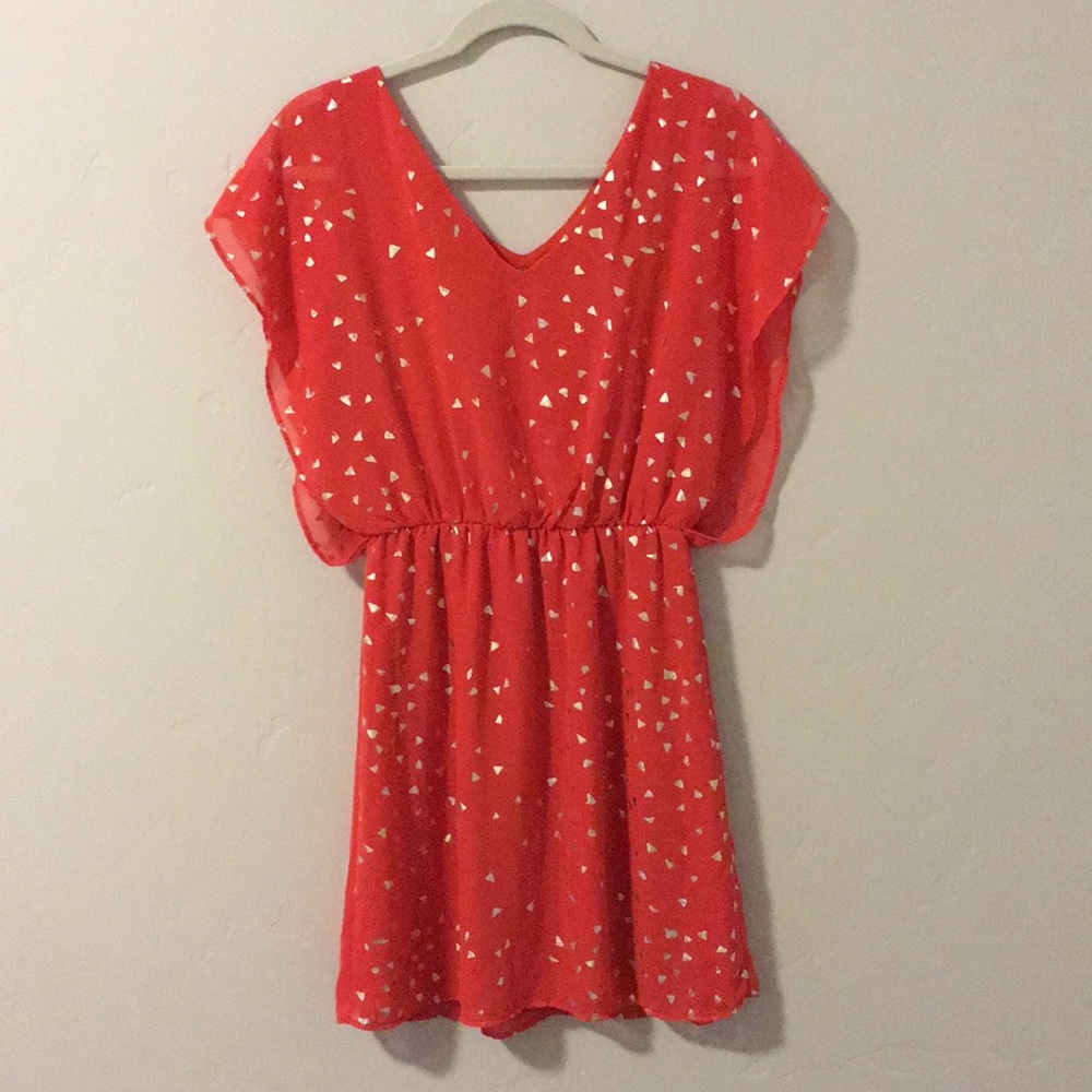 Orange Dress with gold detail.